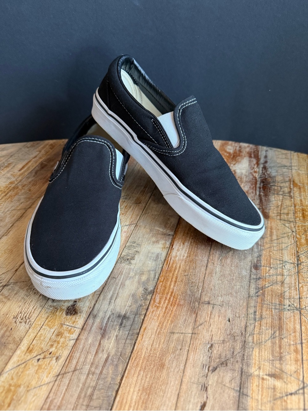 Vans Black and White Canvas Slip-On Sneakers